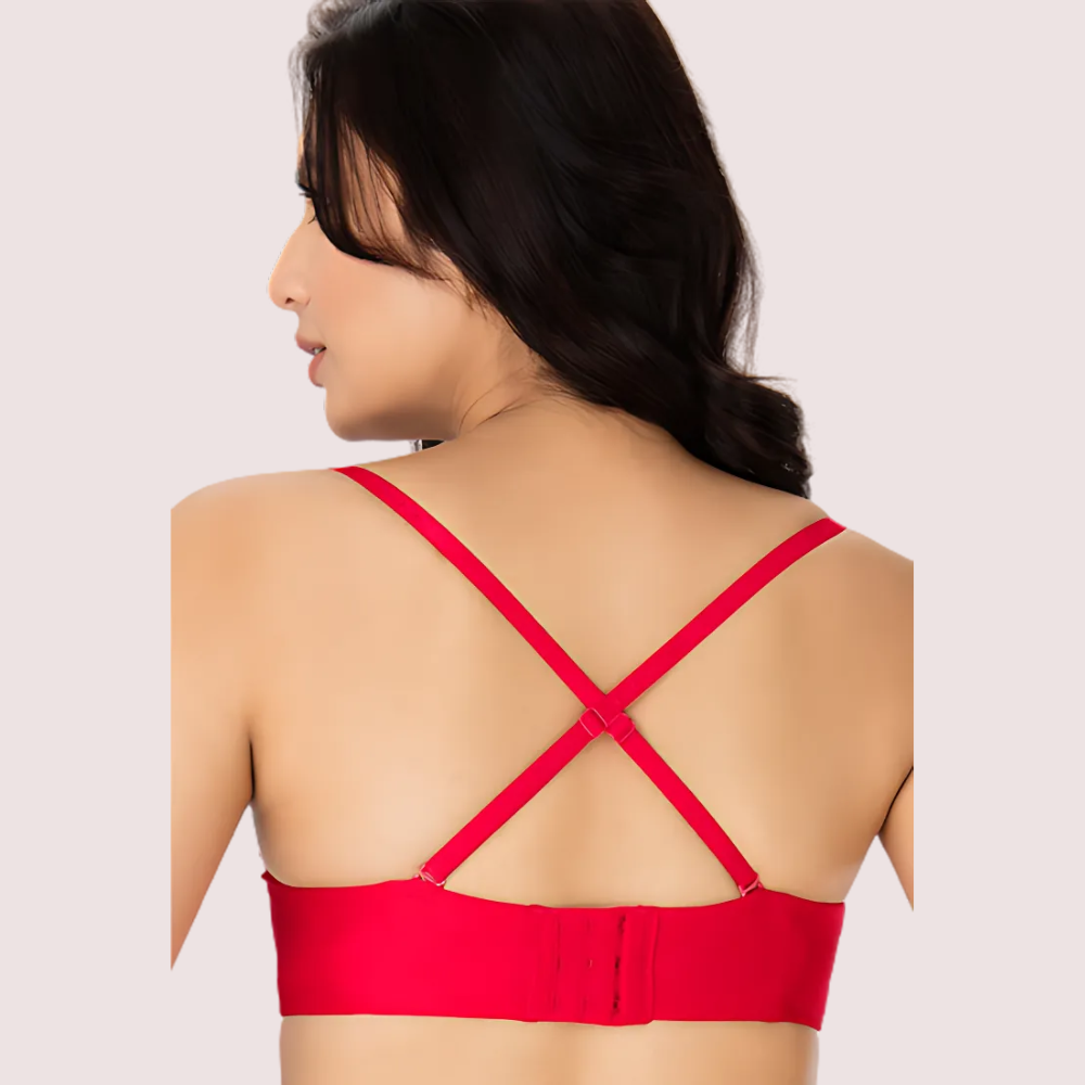 Red strappy top worn by a person on a plain background