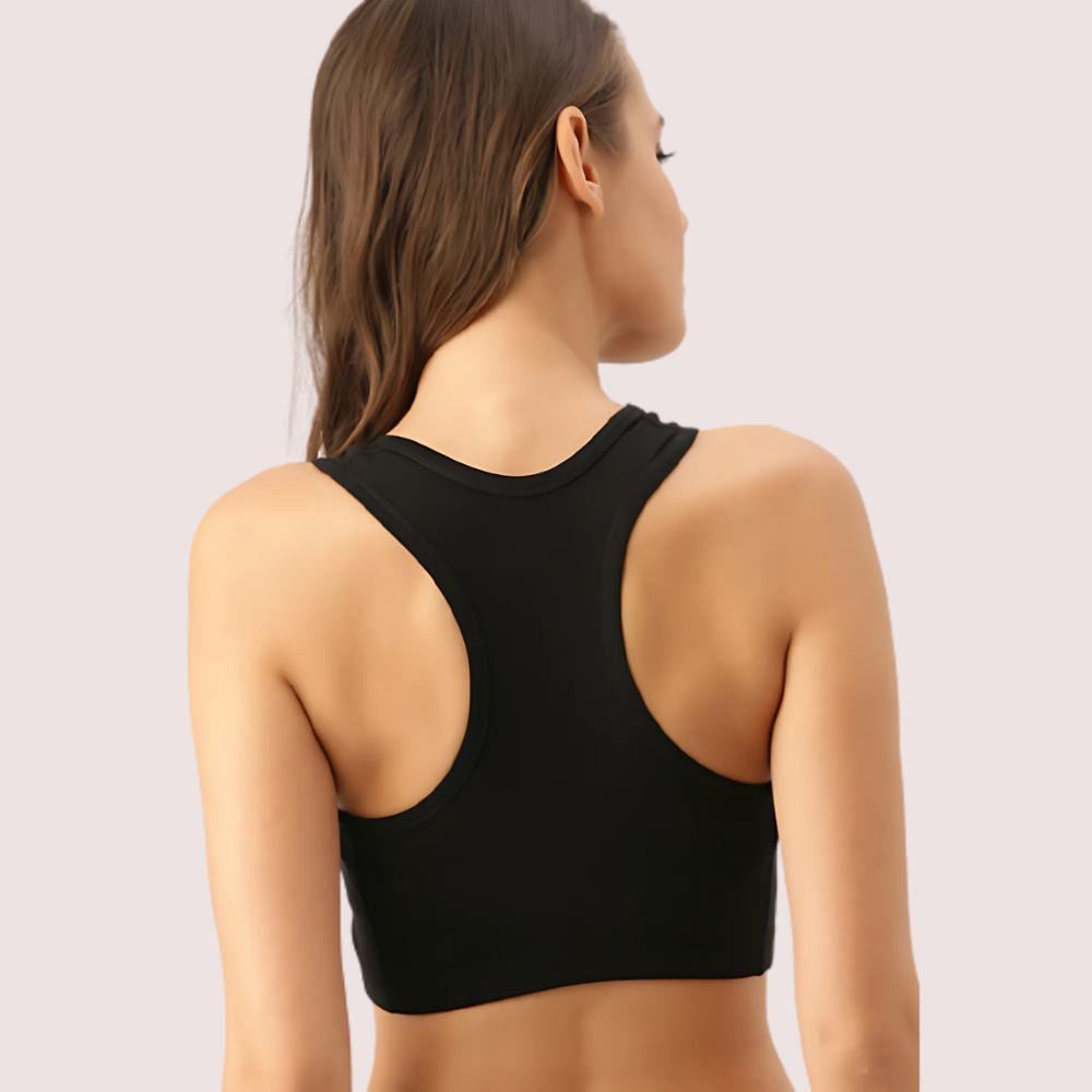 Black sports bra worn by a person on a light gray background