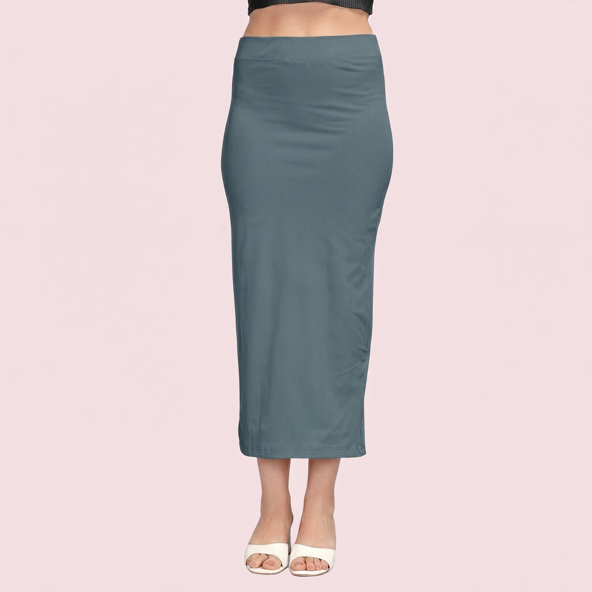 Teal pencil skirt worn by a person on a pink background