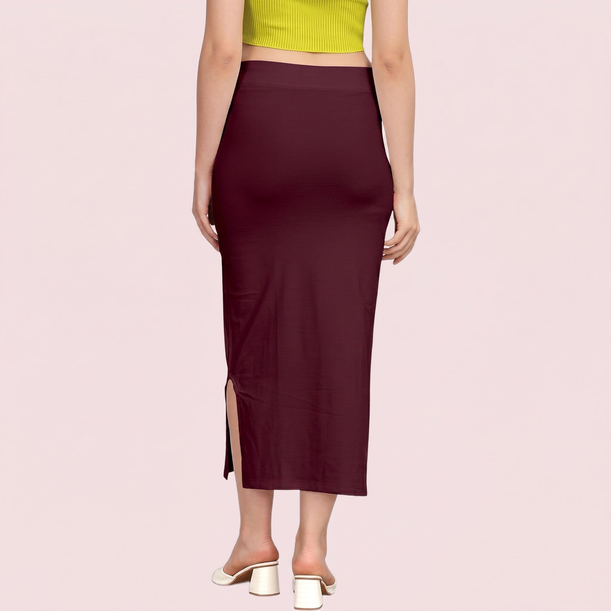 Maroon skirt with a slit on a pink background