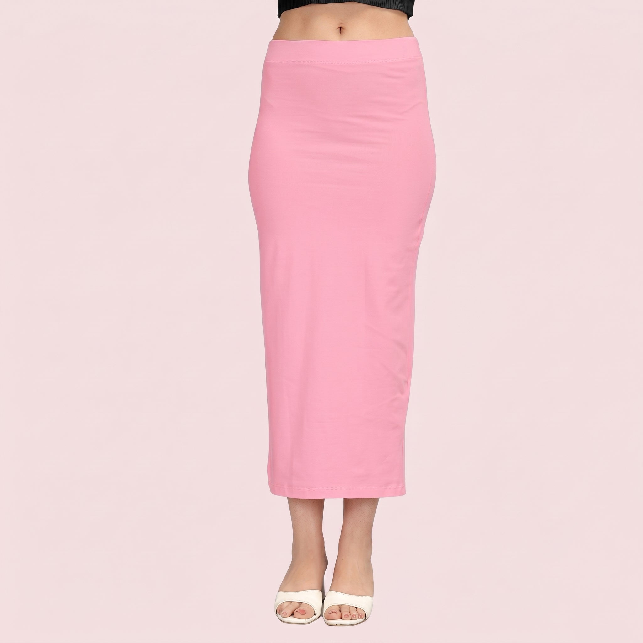 Pink pencil skirt worn by a person on a pink background