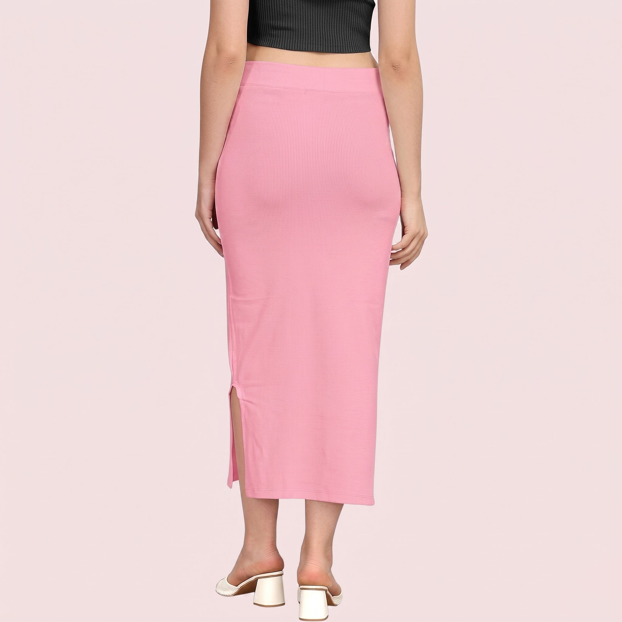 Pink pencil skirt worn by a person on a light pink background