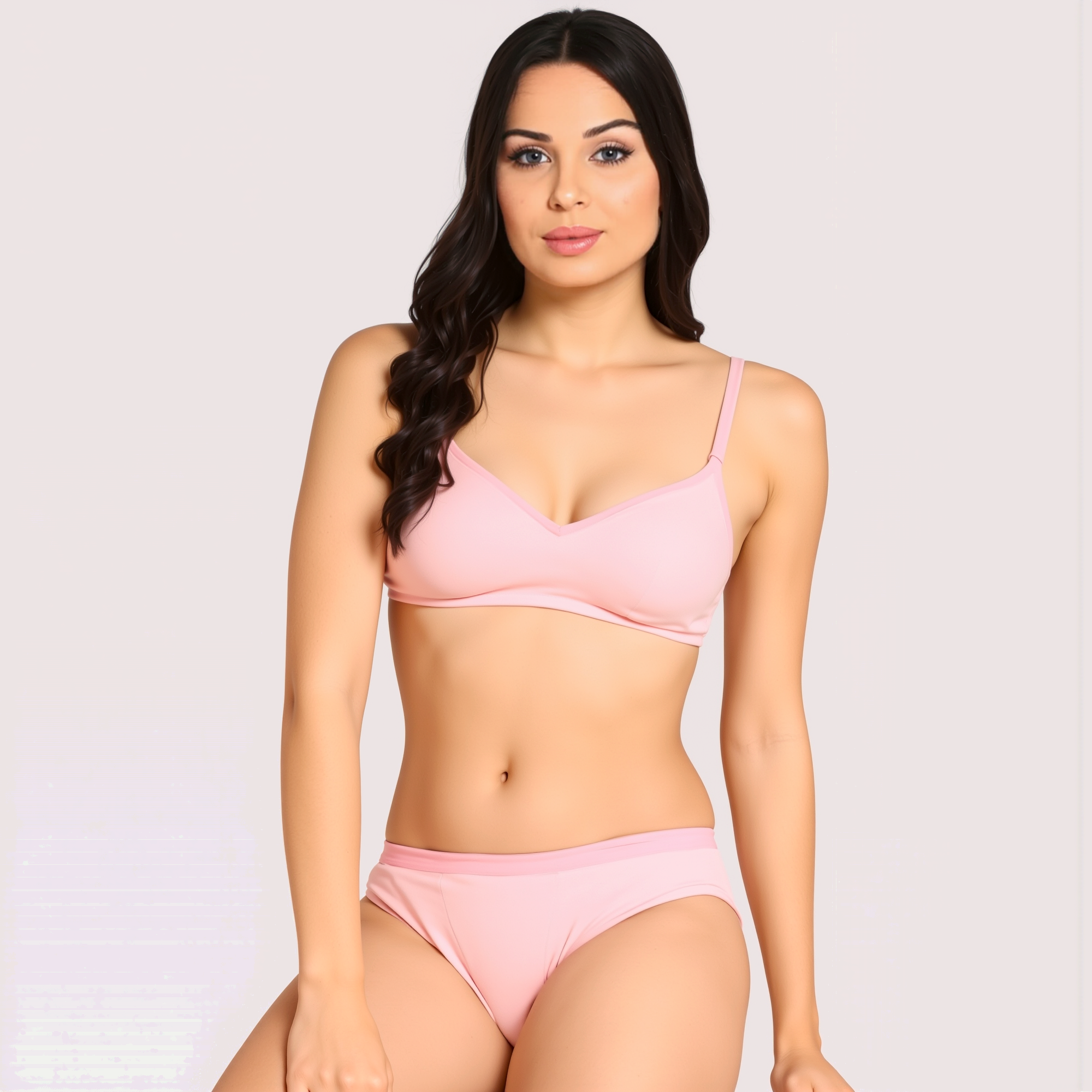 Woman wearing a pink bikini set on a plain background