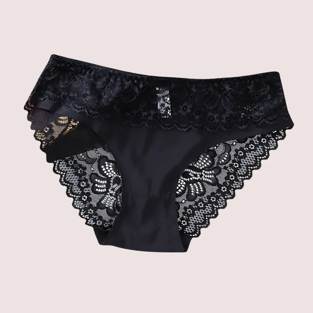 Black lace underwear on a beige background