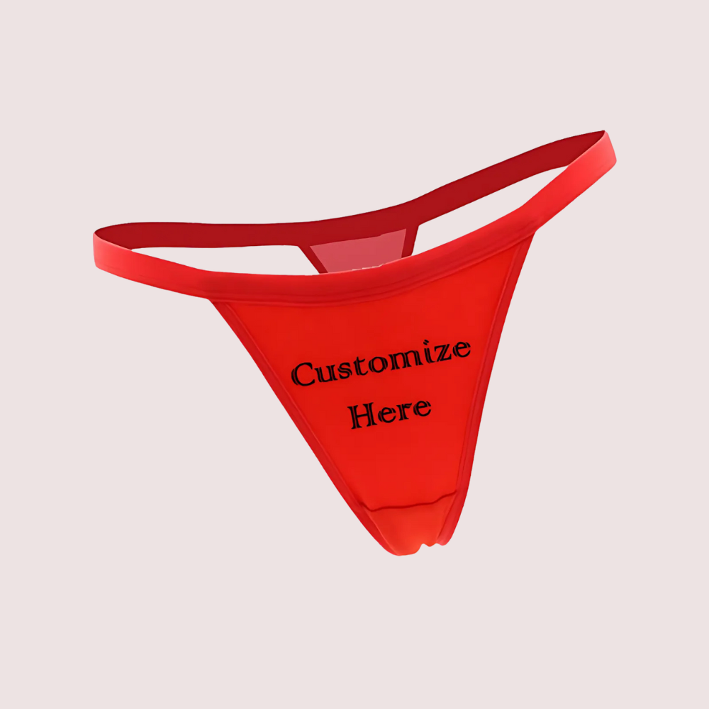 Red men's underwear with 'Customize Here' text on a beige background