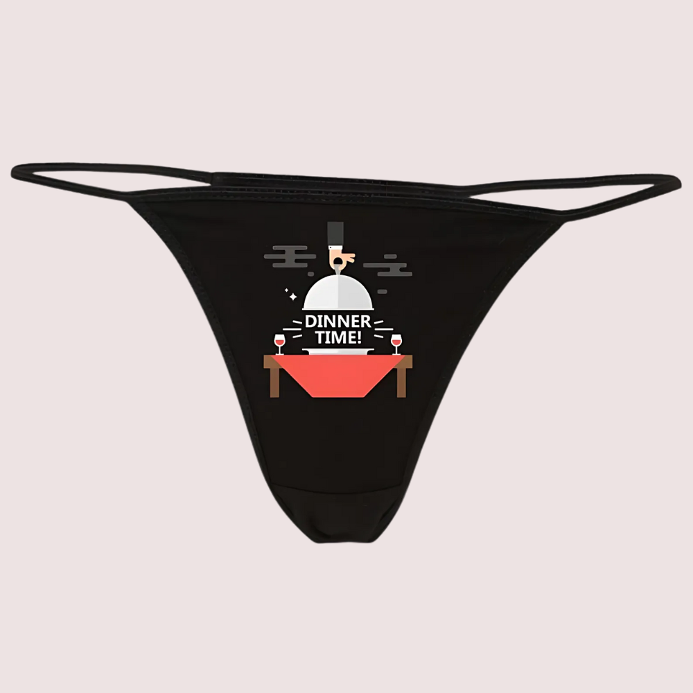 Black thong with 'Dinner Time!' graphic on a light gray background