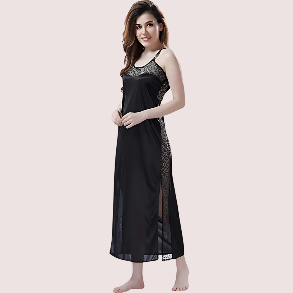 Woman wearing a black lace nightgown on a light pink background