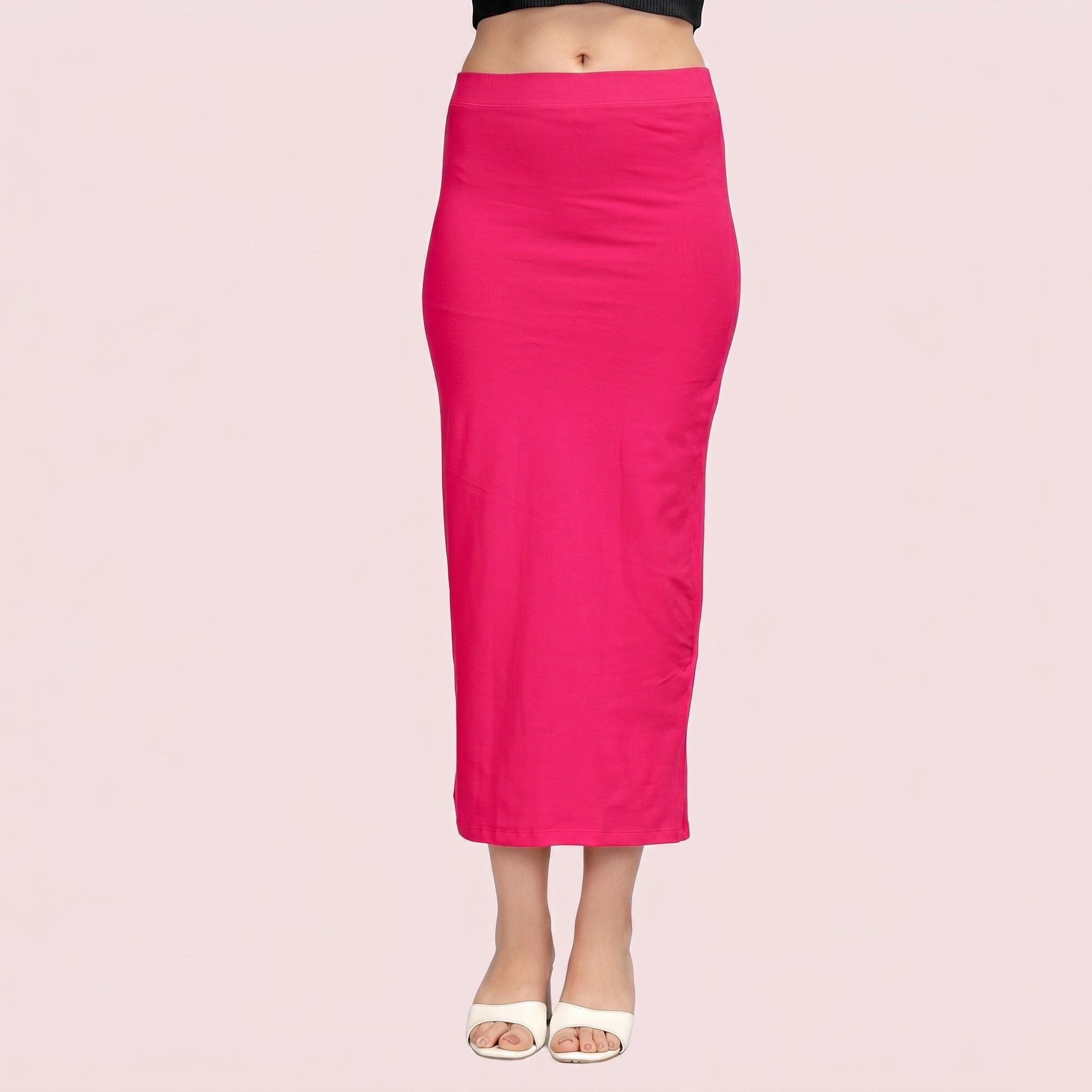 Pink pencil skirt worn by a person on a light pink background