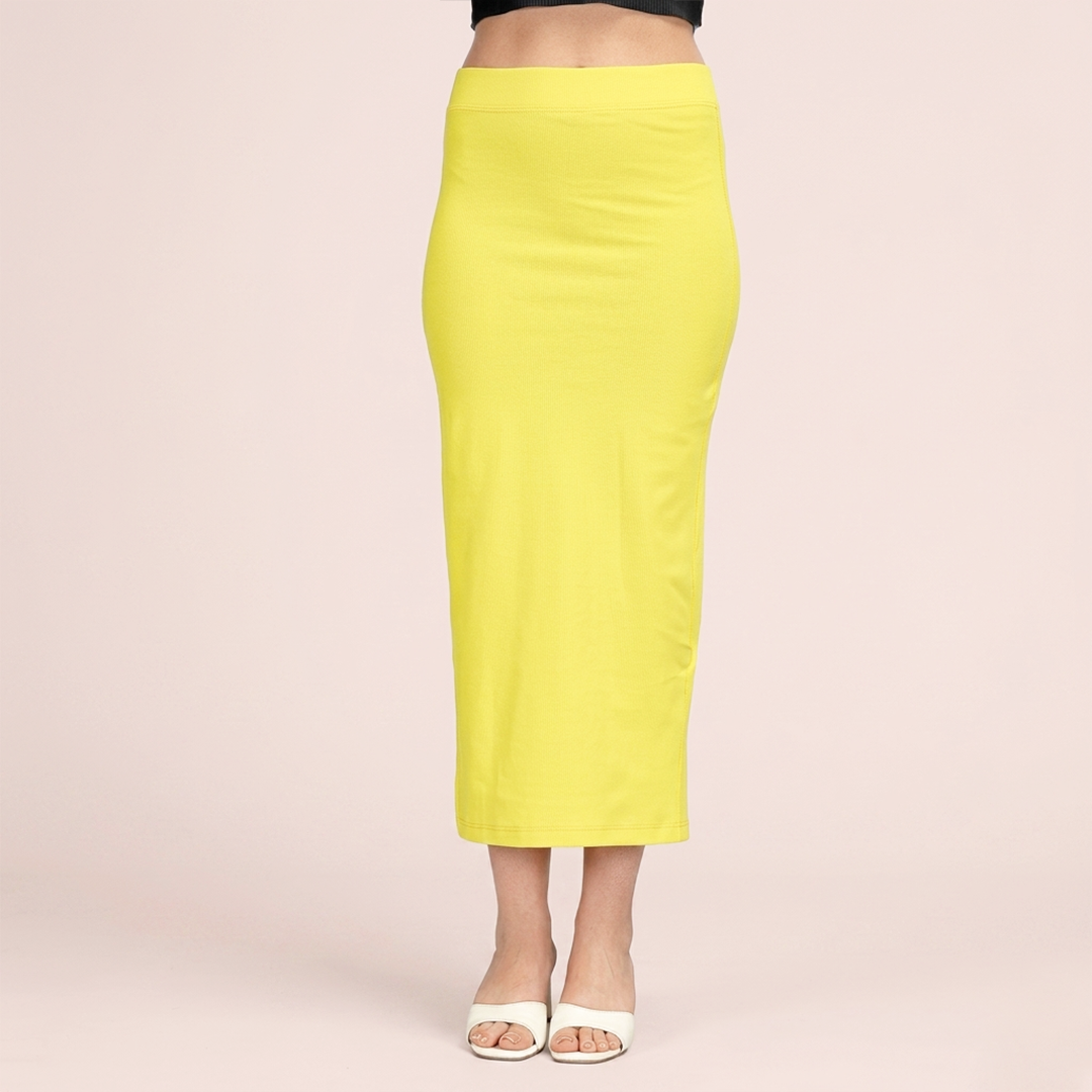 Yellow pencil skirt worn by a person on a light pink background