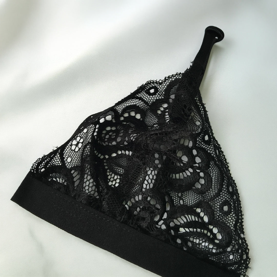 Black lace lingerie set on a white background