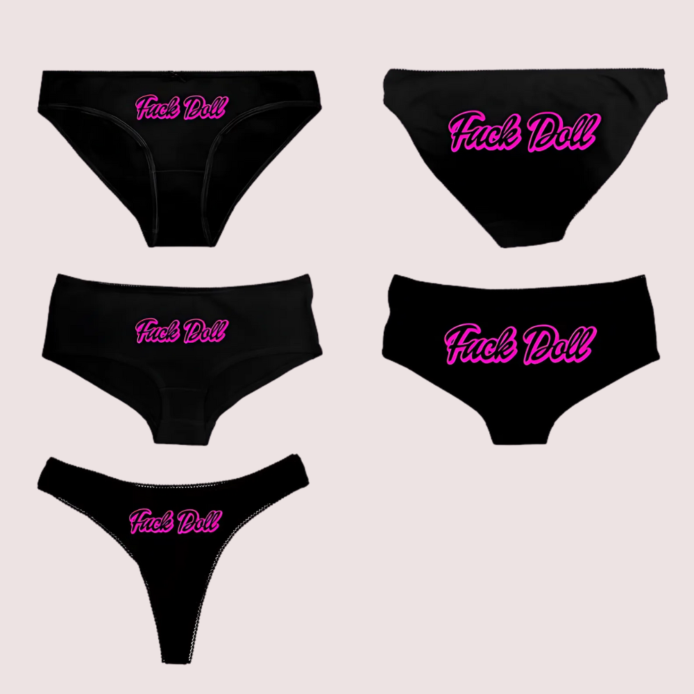 Five black panties with pink 'Fuck Doll' text on a light gray background