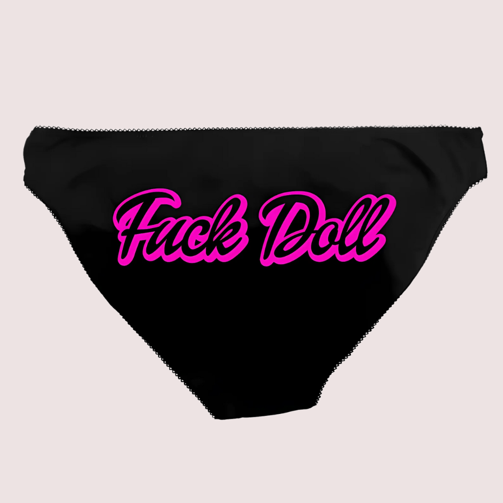 Black underwear with pink text on a light gray background