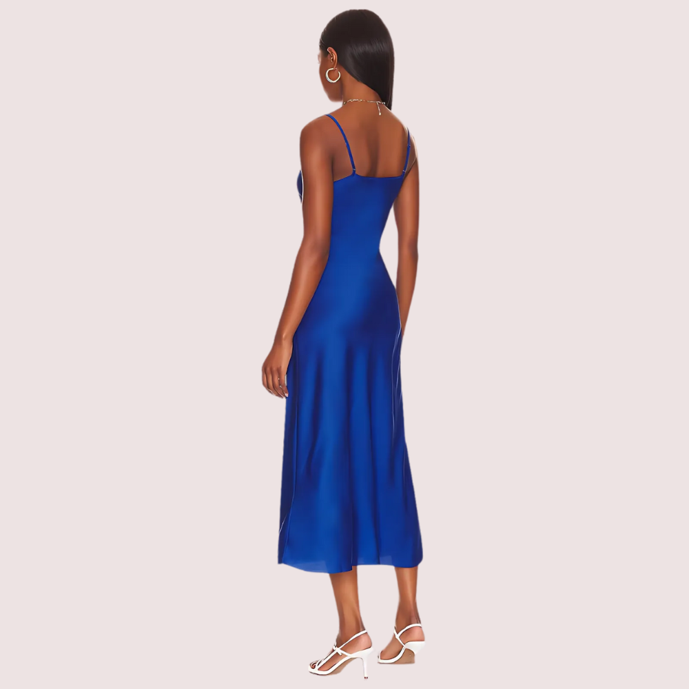Woman wearing a blue dress on a light gray background