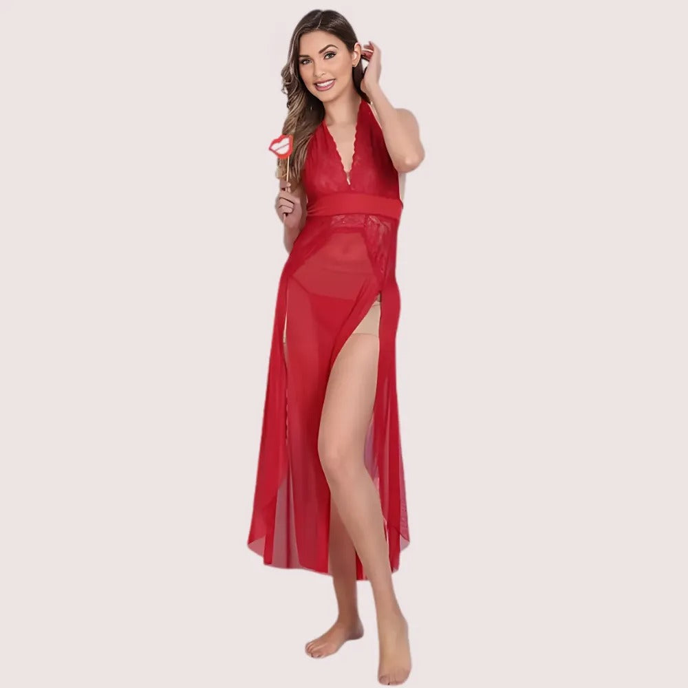 Woman wearing a red dress with a high slit on a light pink background