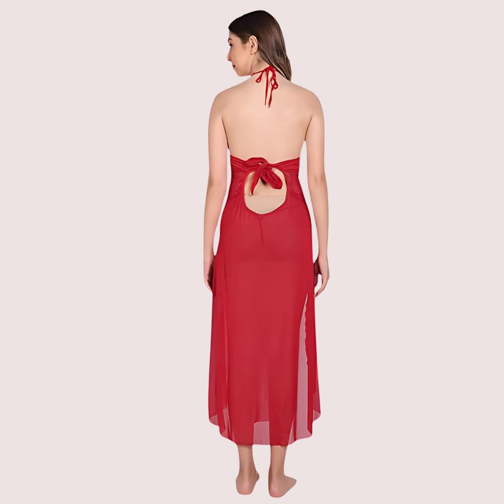 Red halter neck dress with cutout back on a light pink background
