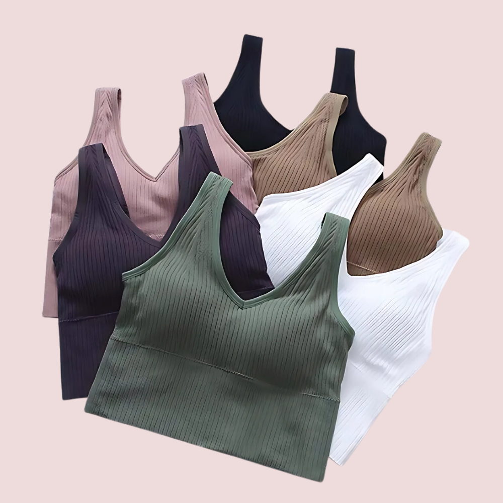 Set of ribbed tank tops in various colors on a light pink background