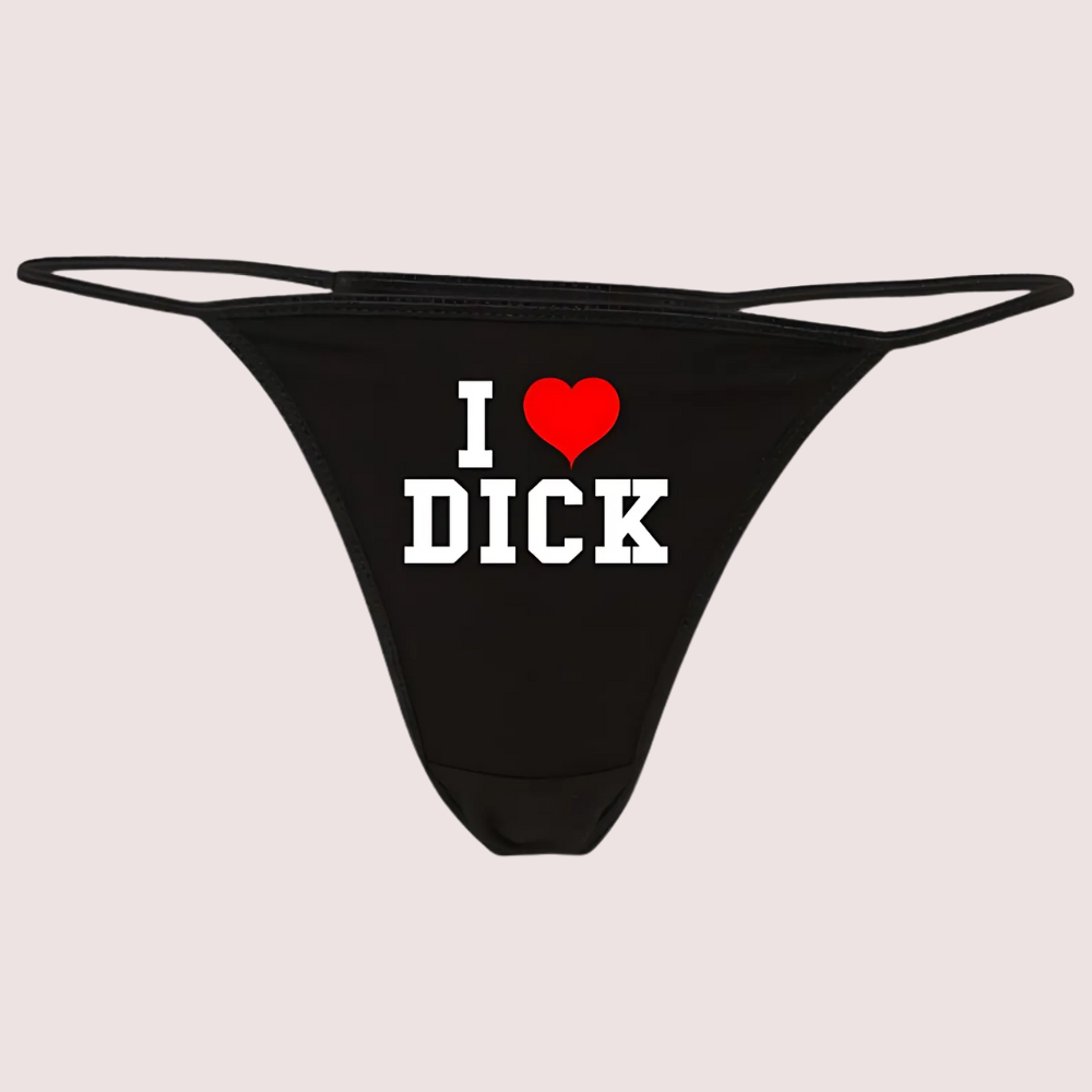 Black thong with 'I ❤️ DICK' text on a light gray background