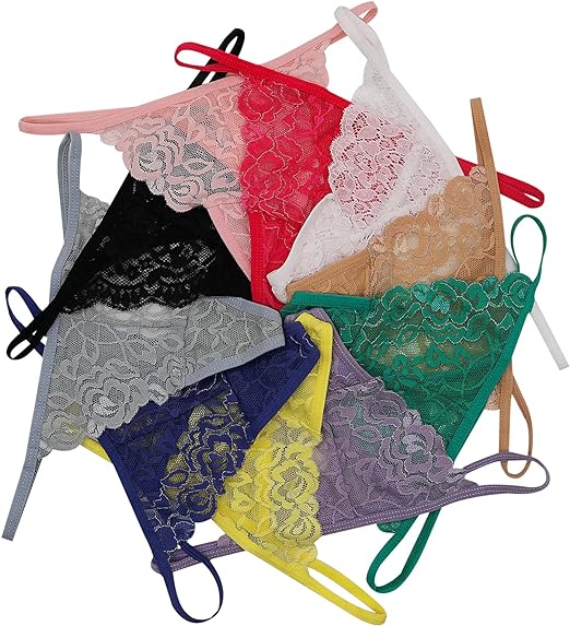 Collection of colorful lace lingerie on hangers against a white background
