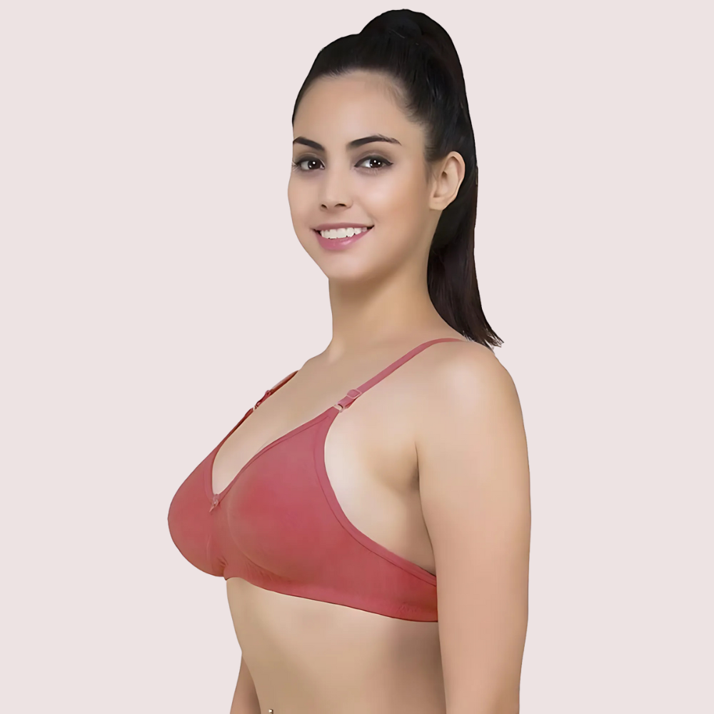 Woman wearing a red bra against a plain background