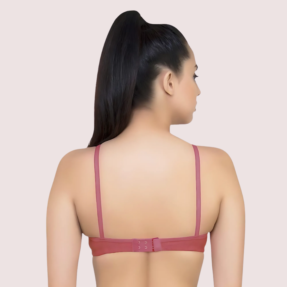 Woman wearing a red bra against a beige background