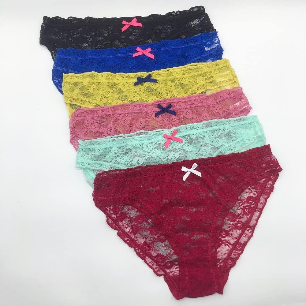 Set of colorful lace panties with bow accents on a white background