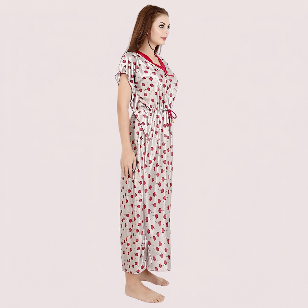 Woman wearing a polka dot nightgown on a light pink background