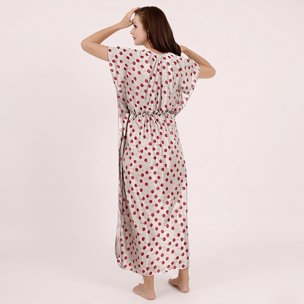 Woman wearing a polka dot dress on a plain background