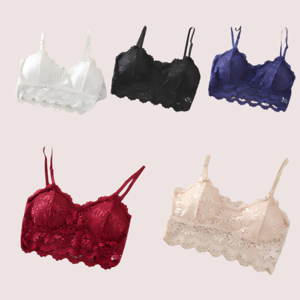 Five lace bras in different colors on a light pink background