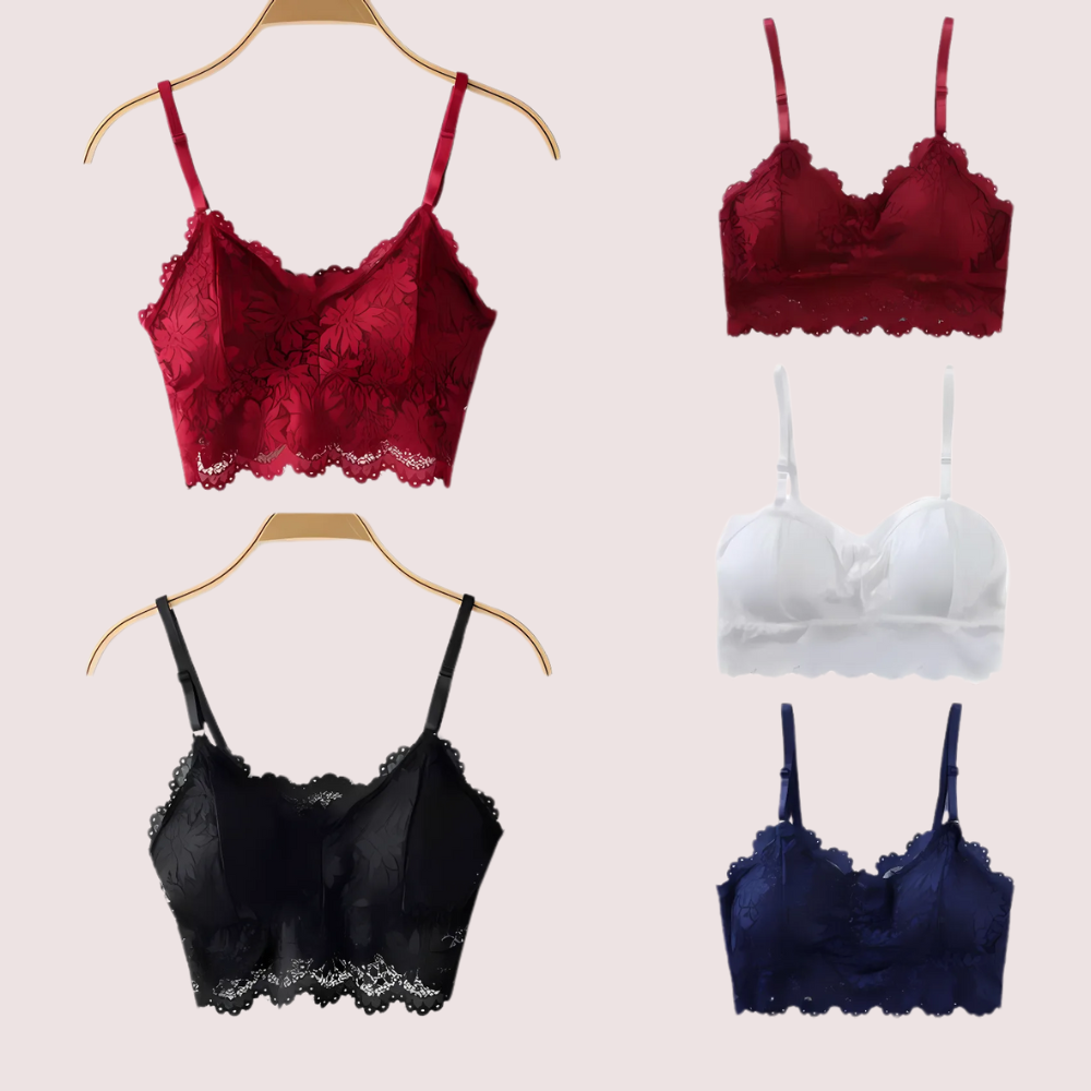Set of lace-trimmed bras in red, burgundy, black, and navy on hangers against a beige background.