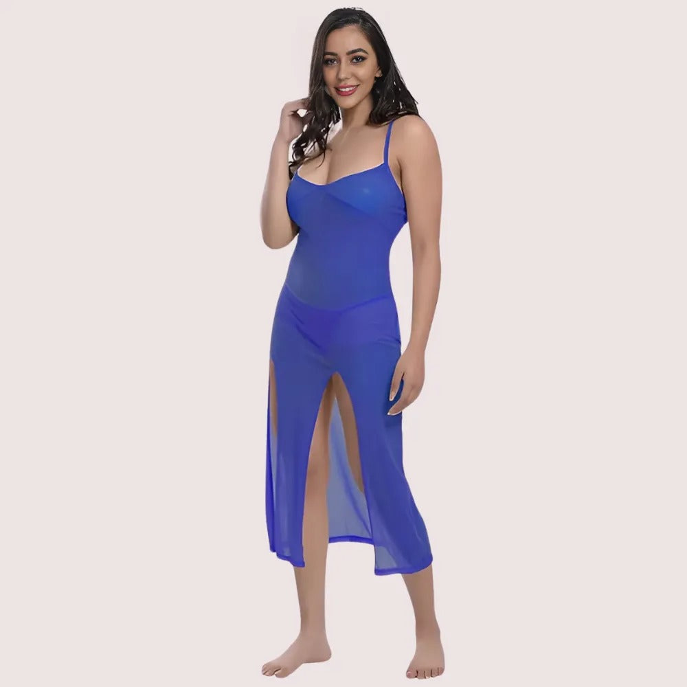Woman wearing a blue dress with a slit on a beige background