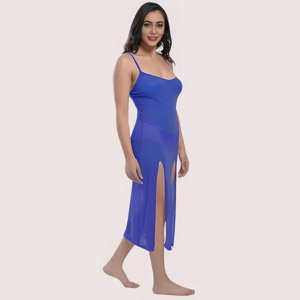 Woman wearing a blue slip dress on a beige background