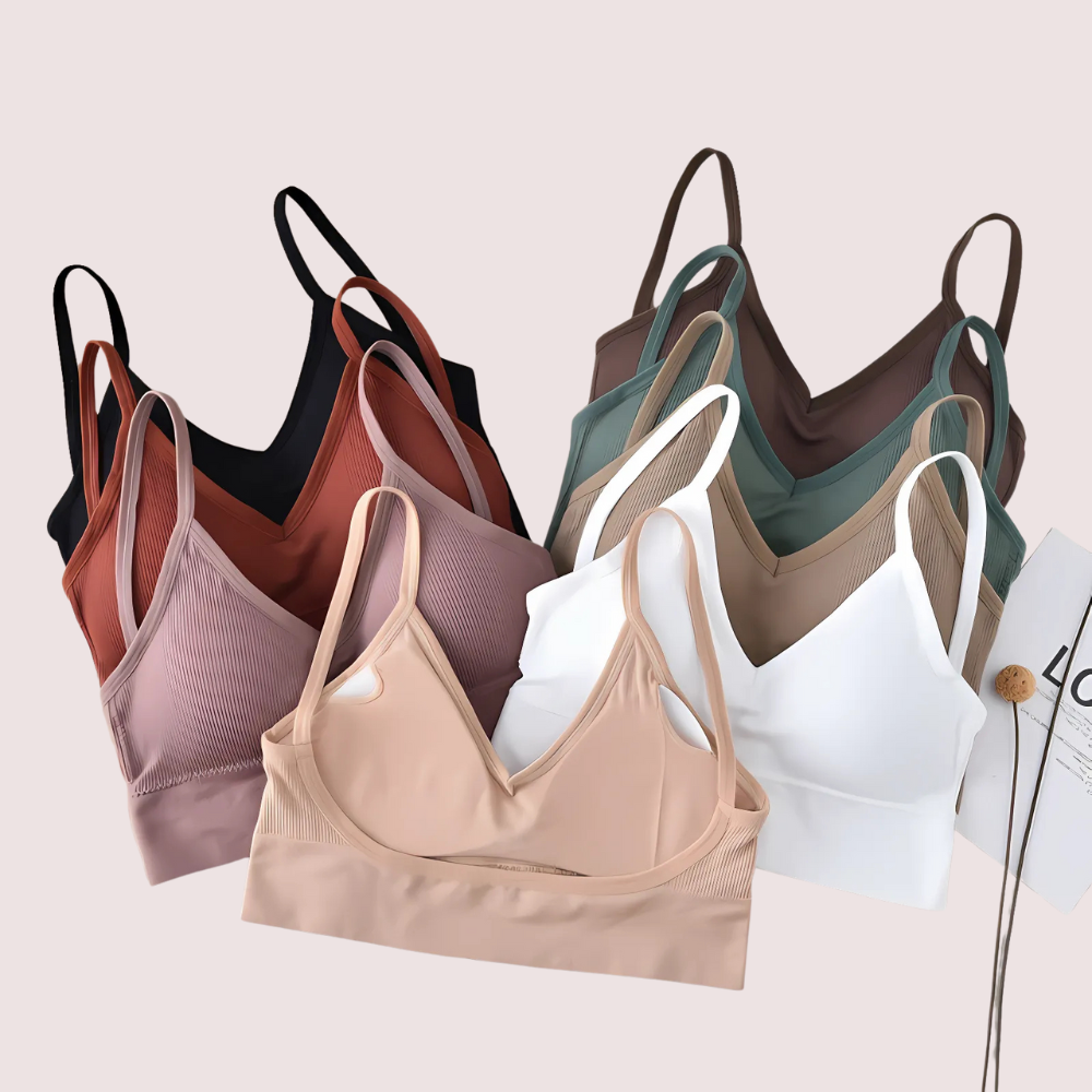 Set of women's bras in various colors on a light background