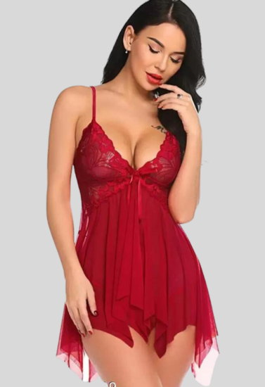 Woman wearing a red lace babydoll dress on a gray background