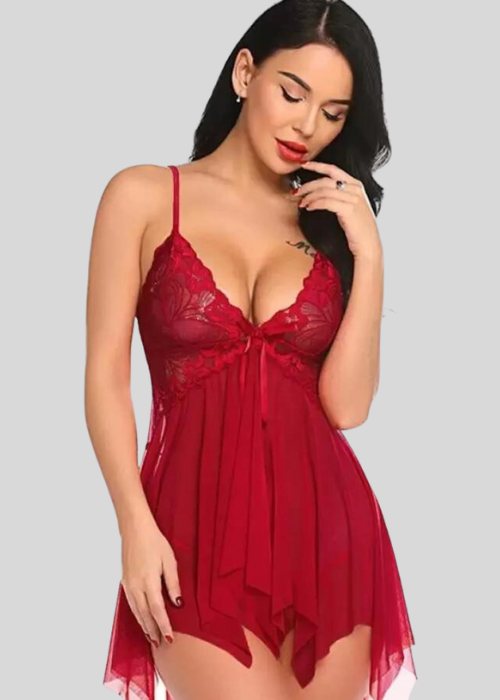 Woman wearing a red lace nightgown against a gray background