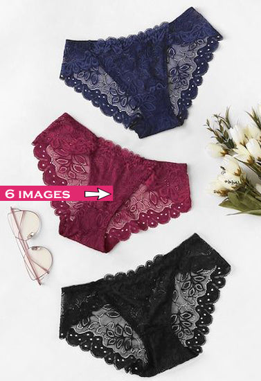 Three pairs of lace-trimmed panties in blue, red, and black on a white background with sunglasses and flowers.
