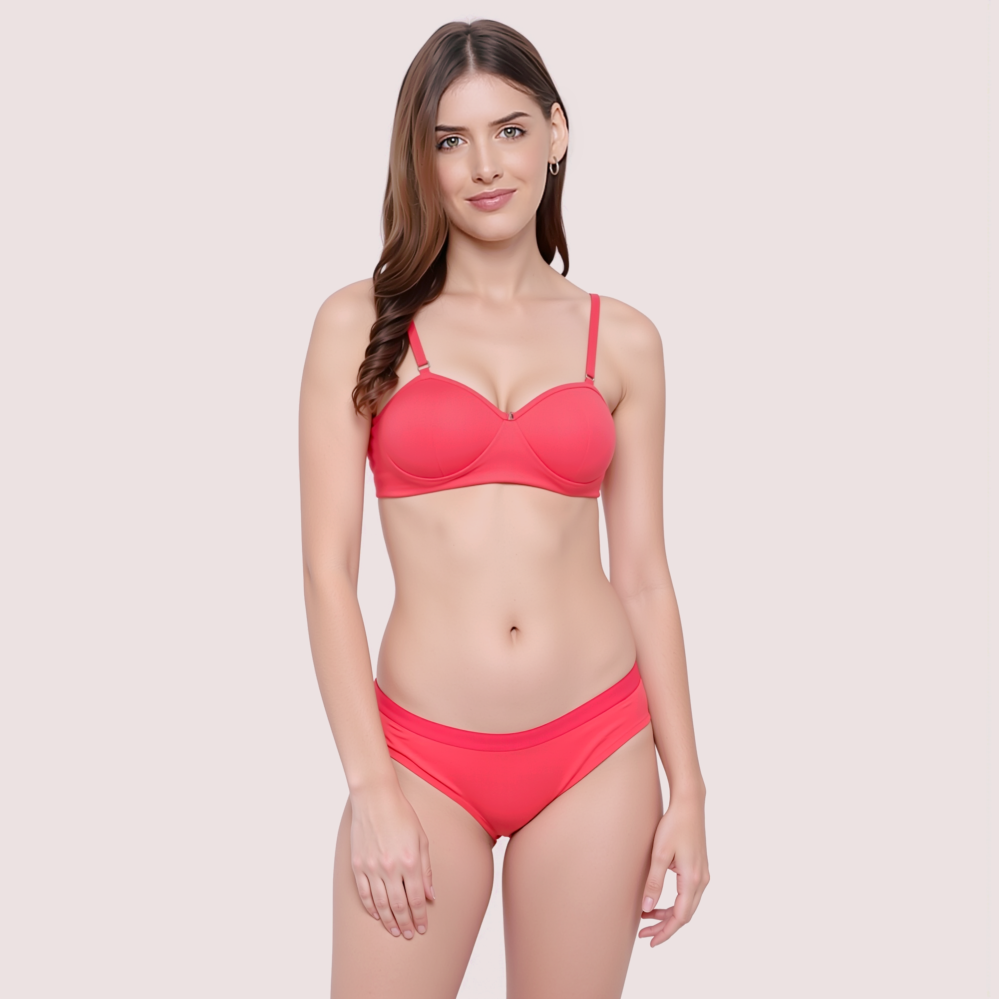 Woman wearing a red bikini set on a beige background