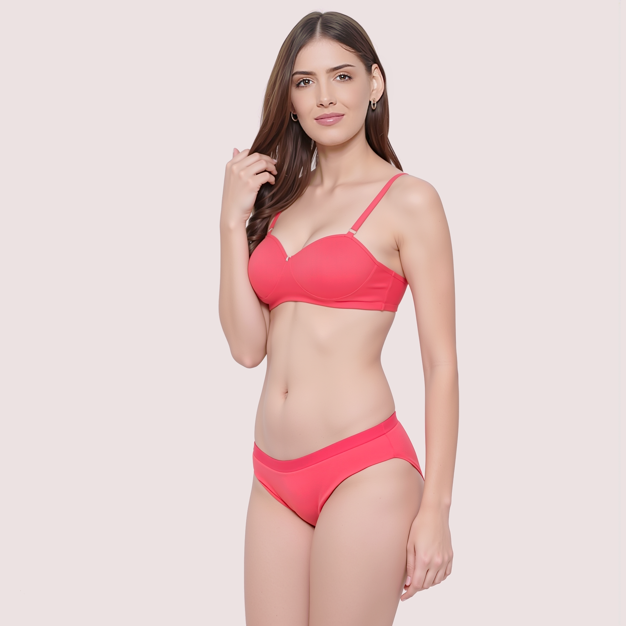 Woman wearing a pink bikini on a light pink background