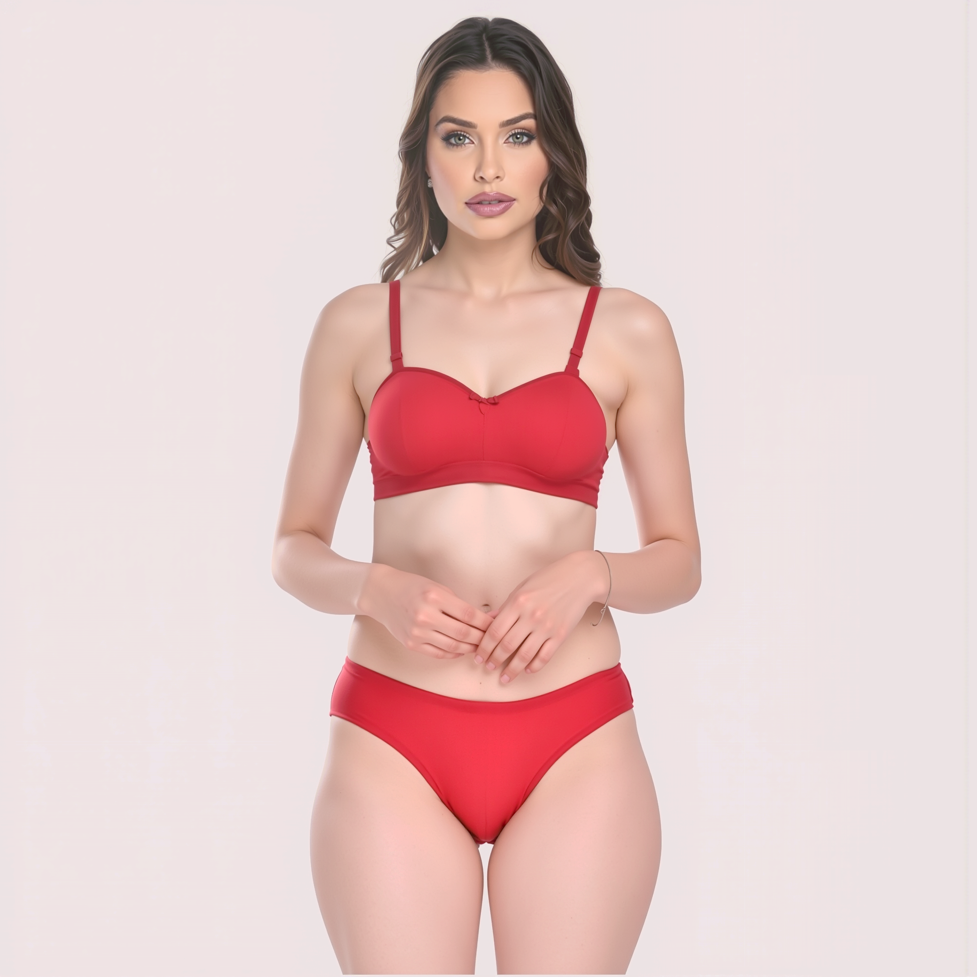 Woman wearing a red bikini set on a light pink background