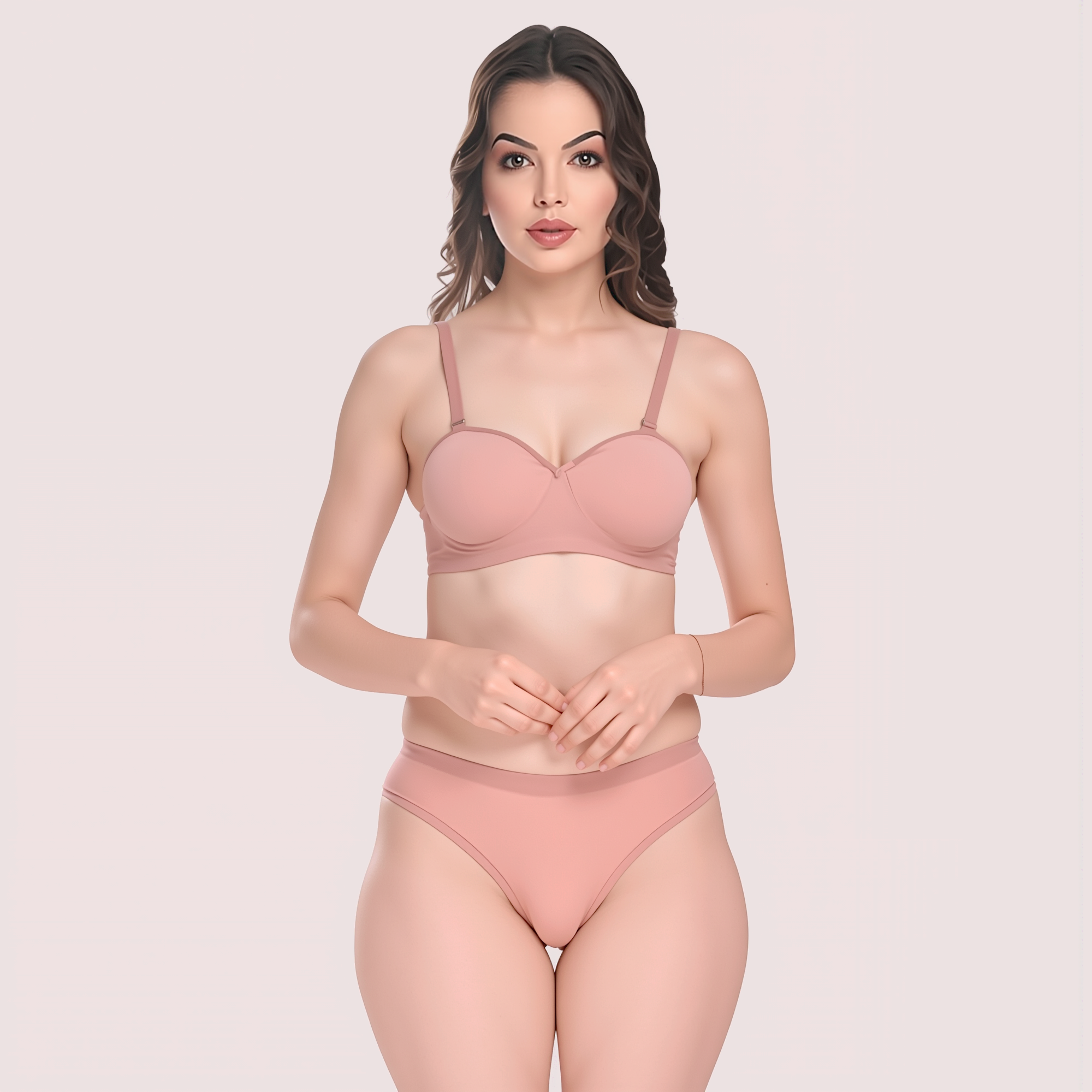 Woman wearing a pink bra and panties set on a light pink background
