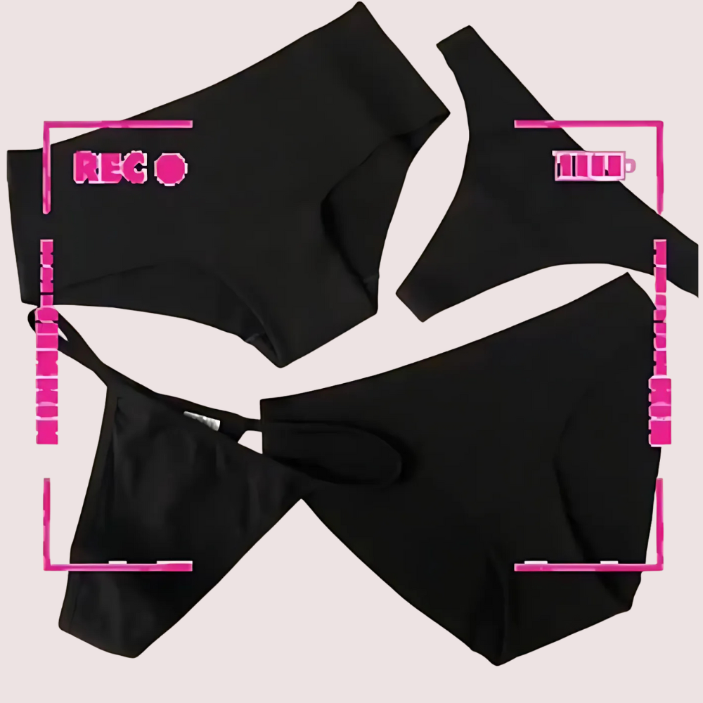 Black bikini set on a light pink background with recording and zoom indicators.