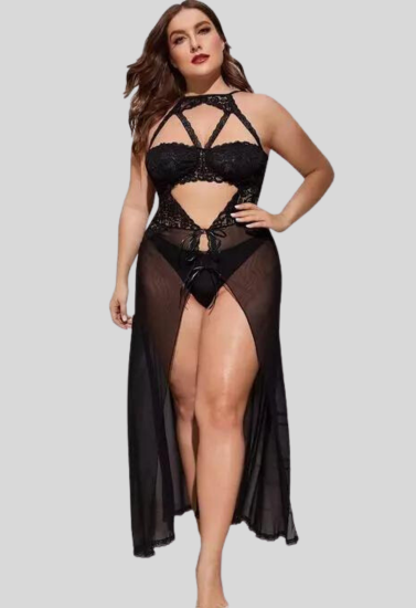 Woman wearing a black lingerie set with sheer overlay on a gray background