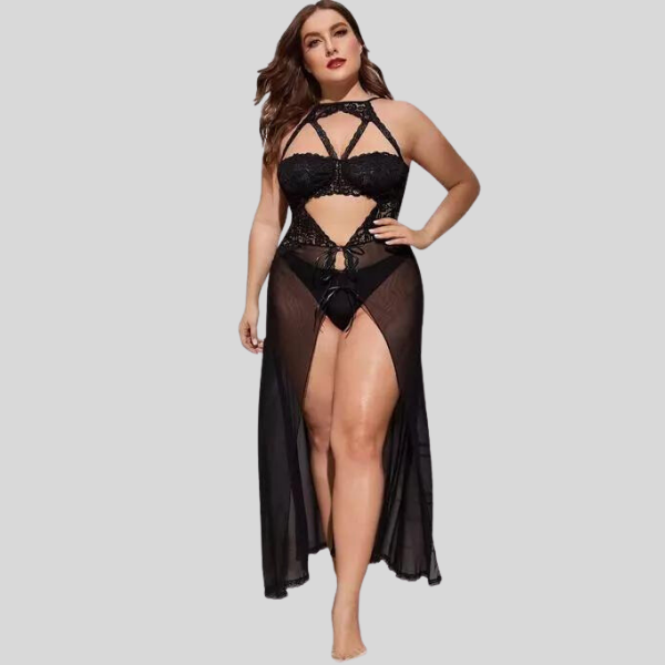 Woman wearing a black lace lingerie set with sheer overlay on a gray background