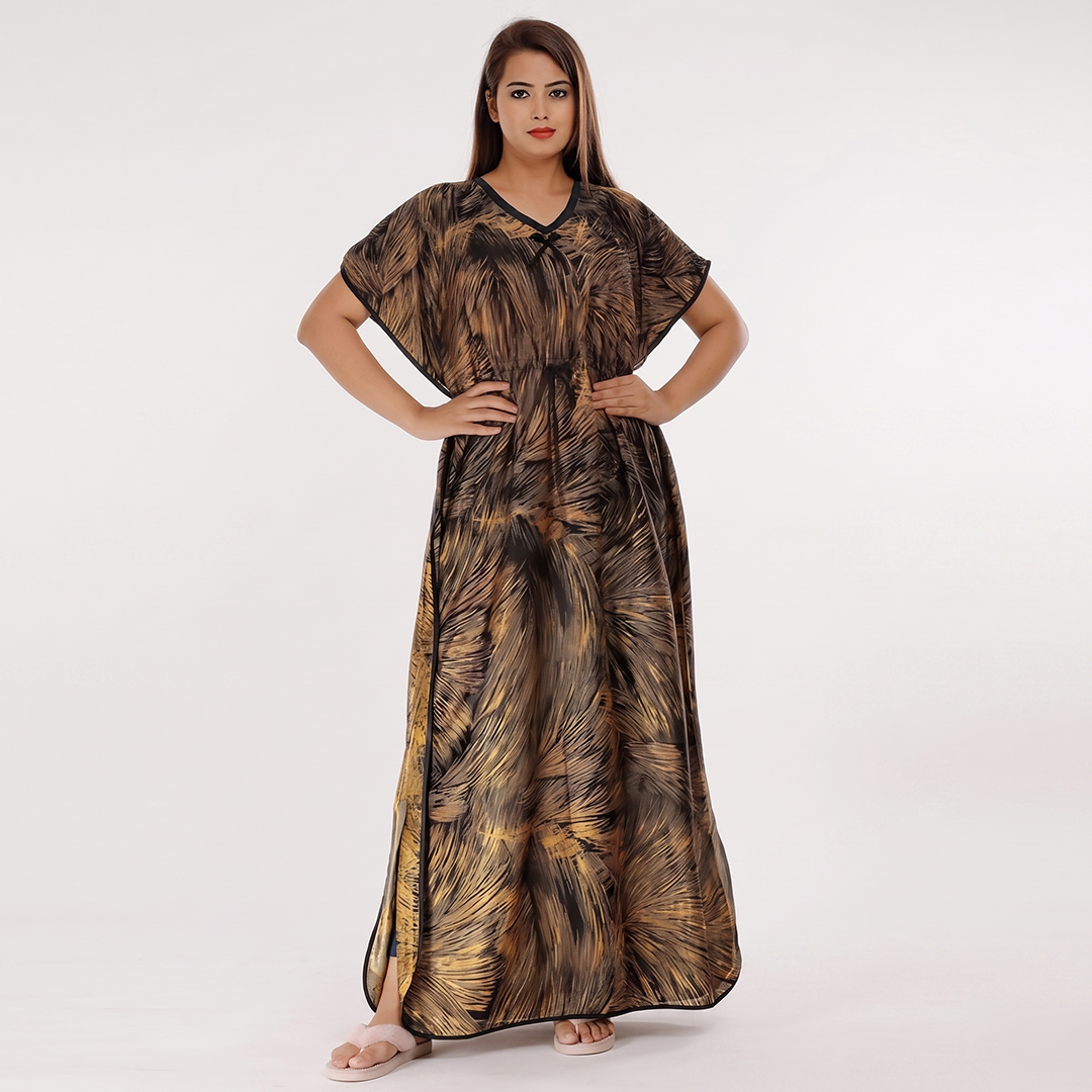 Woman wearing a long, patterned dress on a white background