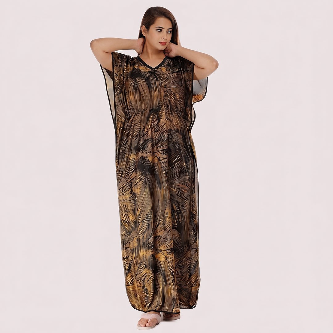 Woman wearing a long, patterned dress on a plain background