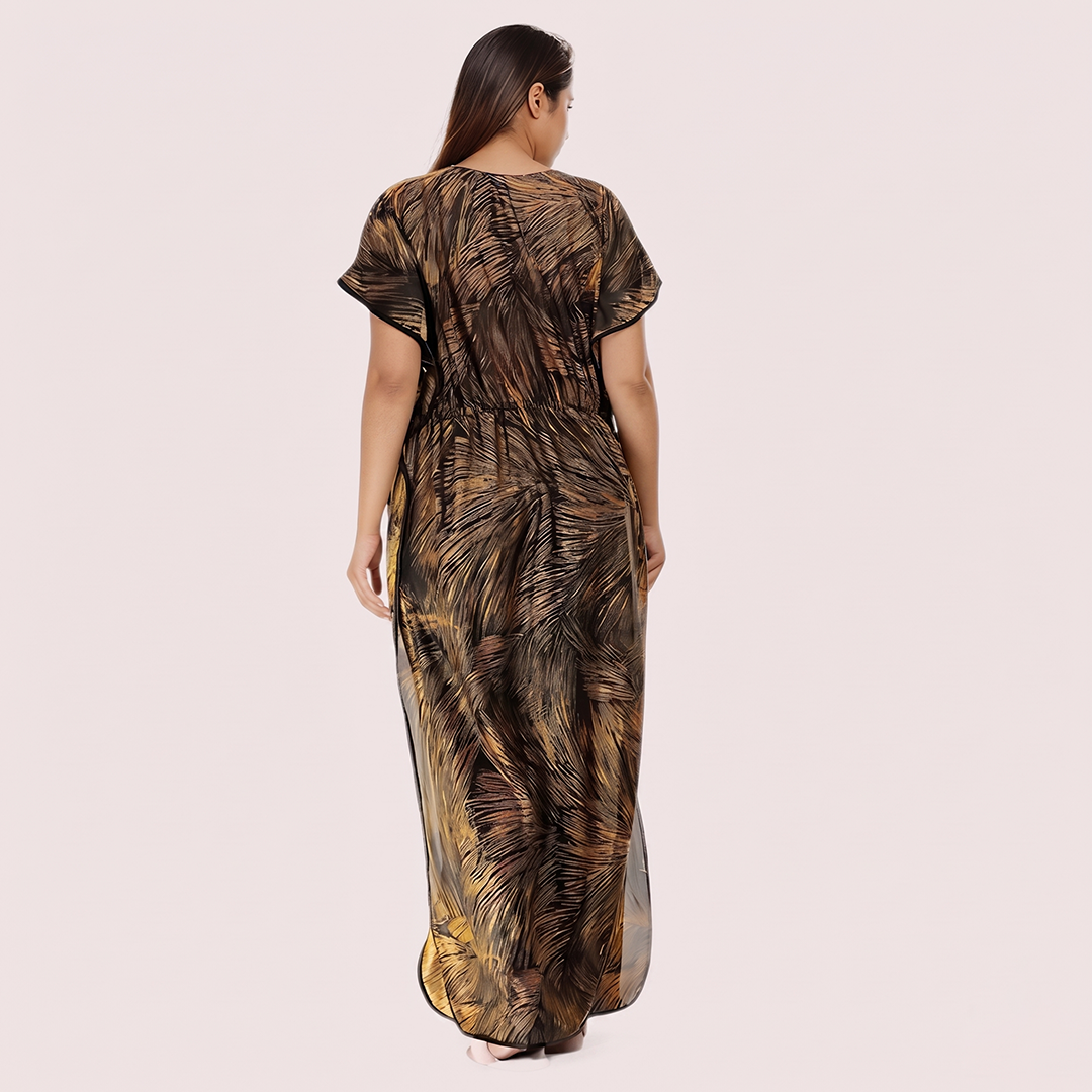 Woman wearing a long, patterned dress on a plain background