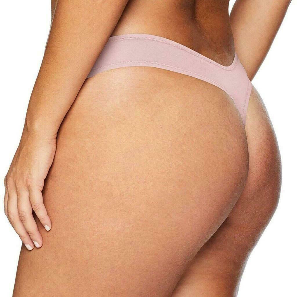 Light pink underwear worn by a person on a white background