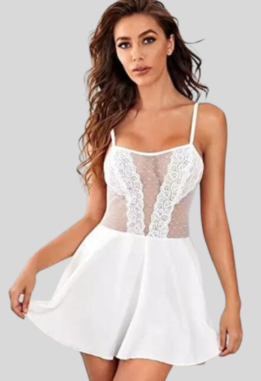 Woman wearing a white lace dress on a gray background