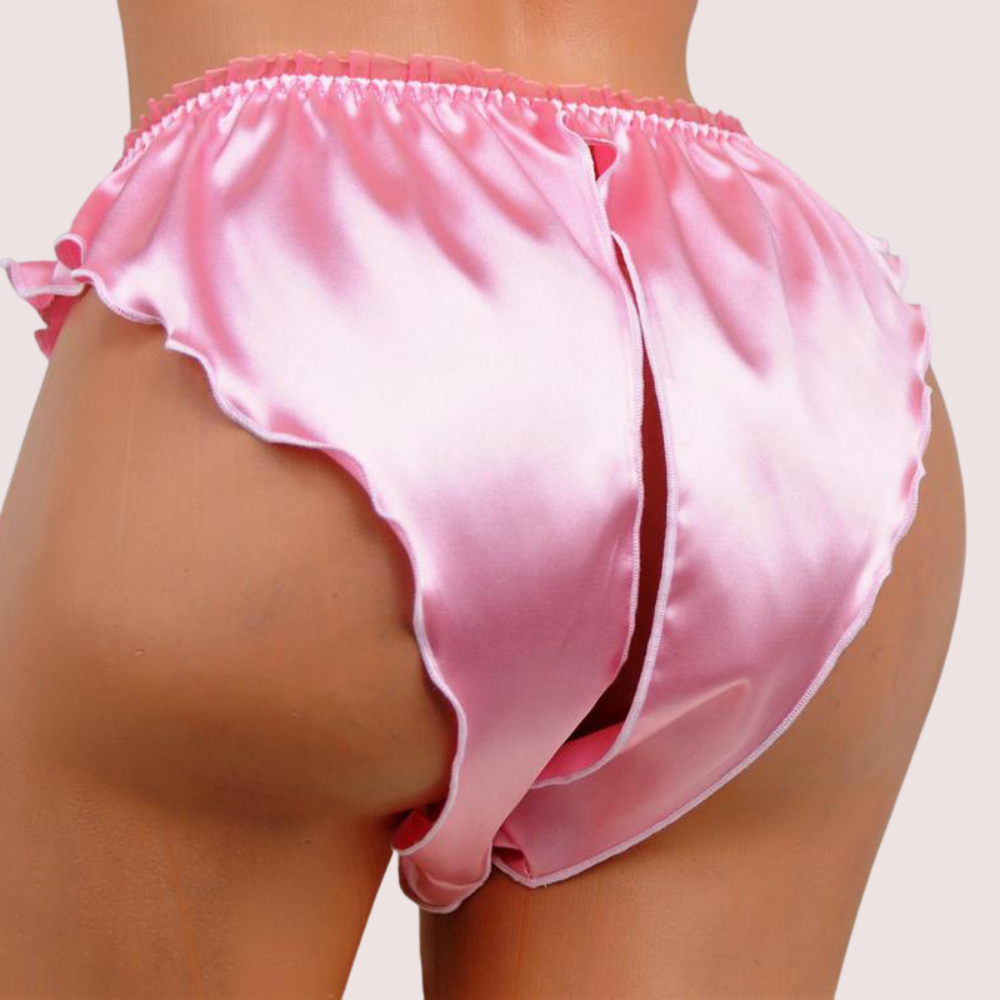 Pink satin bloomers worn by a person on a plain background