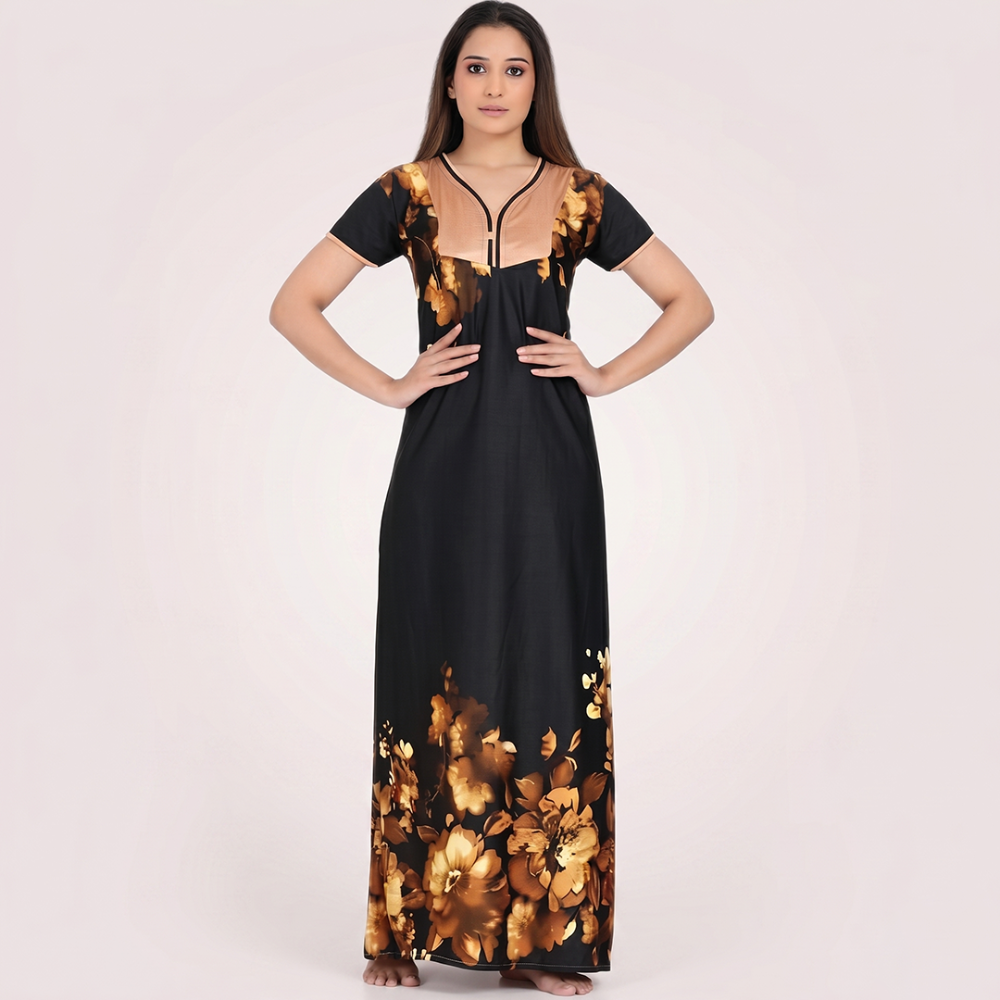 Woman wearing a black dress with gold floral patterns on a white background