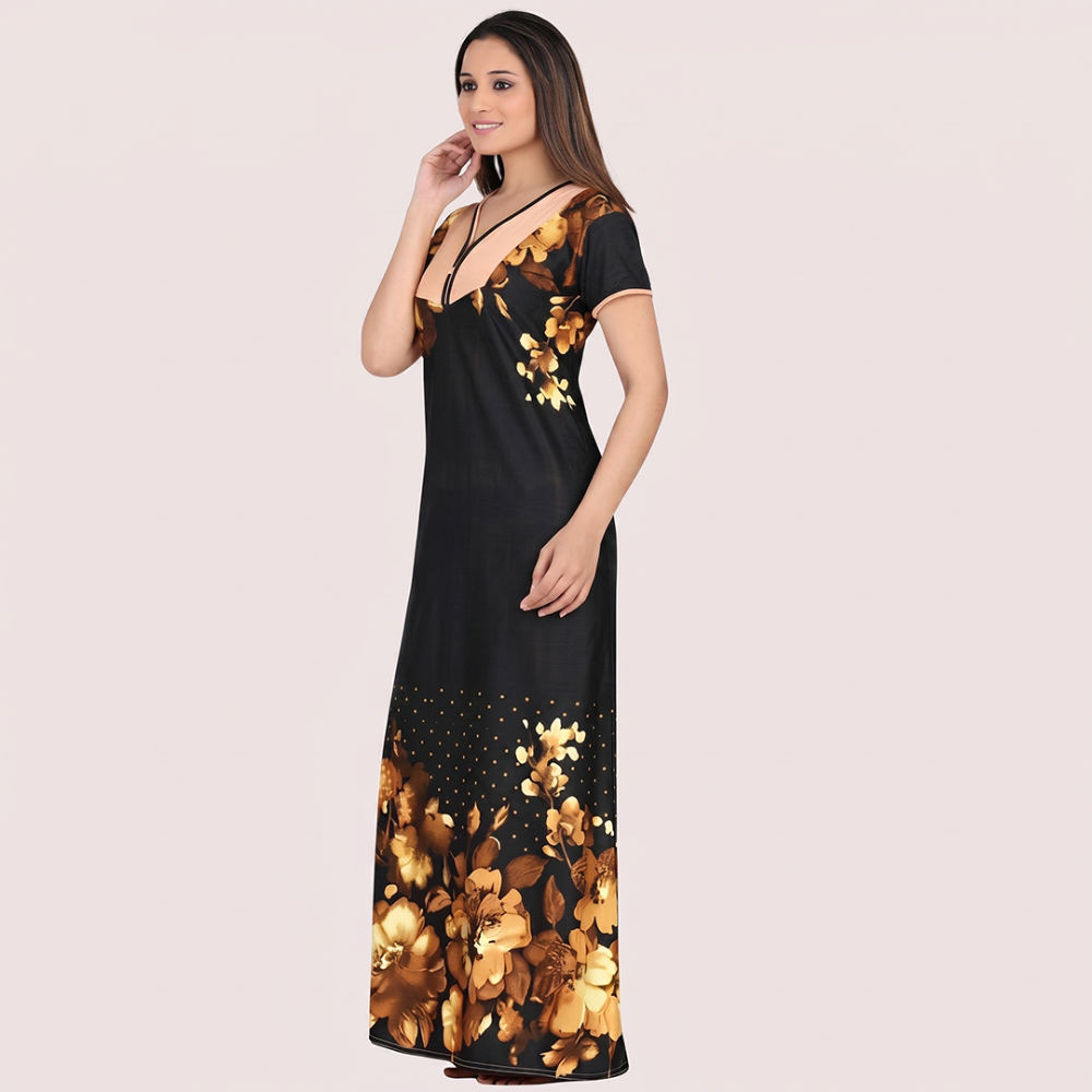 Woman wearing a black dress with gold floral patterns on a beige background